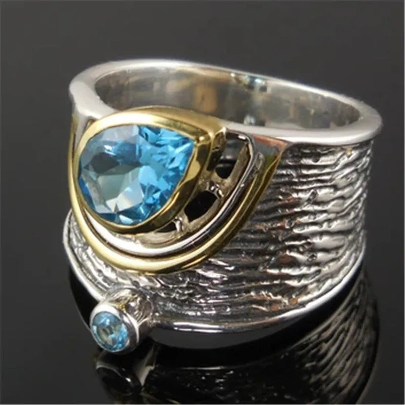 Blue drop-shaped women's ring with inlaid zircon rhinestones on an alloy band.