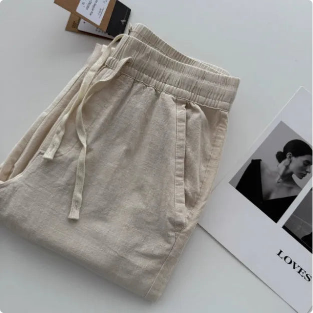 Men's loose straight-leg casual summer pants in beige colour with a drawstring waist.