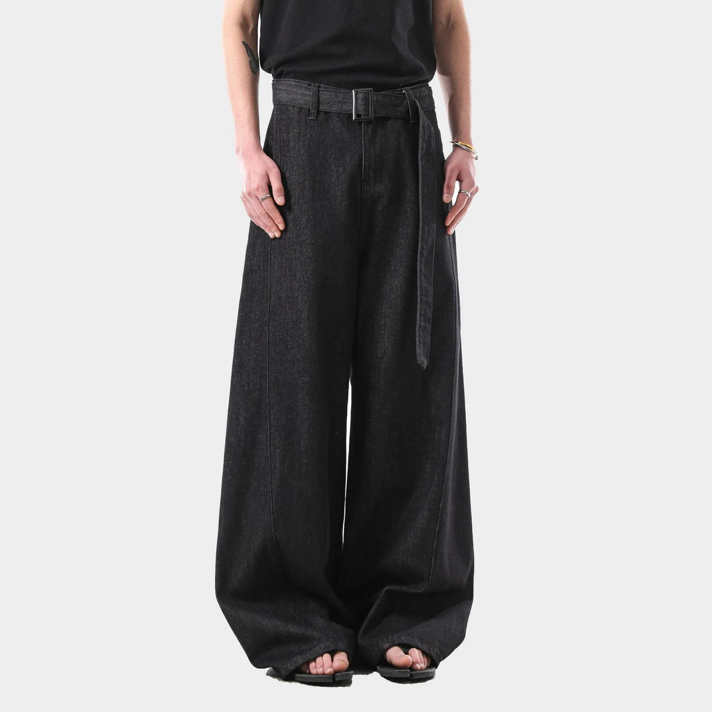 Black high-waist straight-leg denim jeans with a zip fly on a plain background.