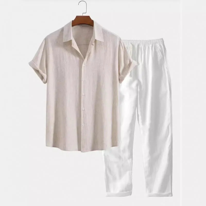 Man wearing a loose casual short-sleeve linen-look shirt and matching trousers in a solid colour.