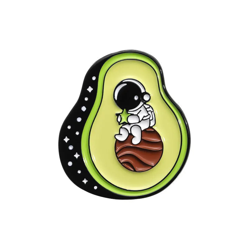 Colourful zinc alloy metal brooch with cartoon fruit and letter design on fabric.