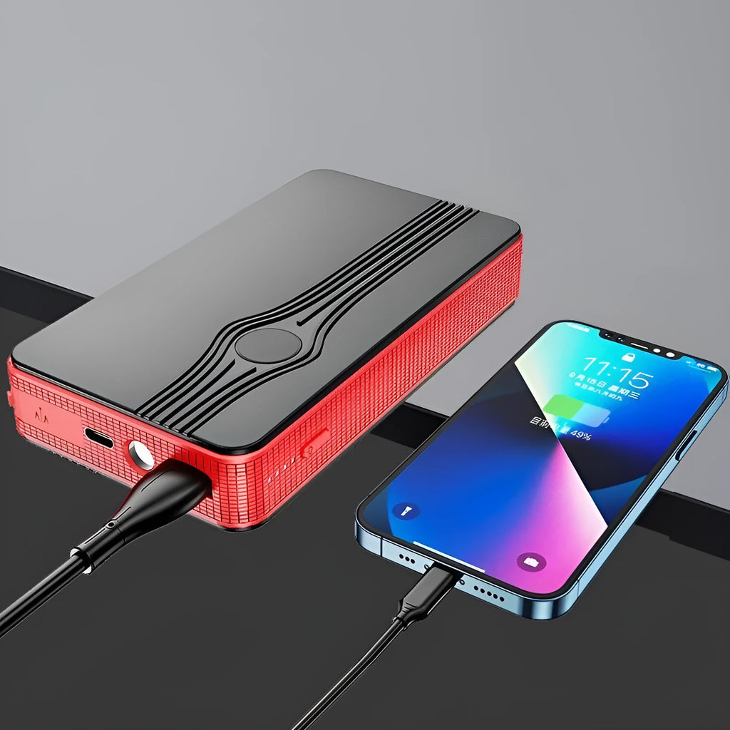 Red K4-E portable car jump starter power bank with USB port and display, shown next to included data cable.