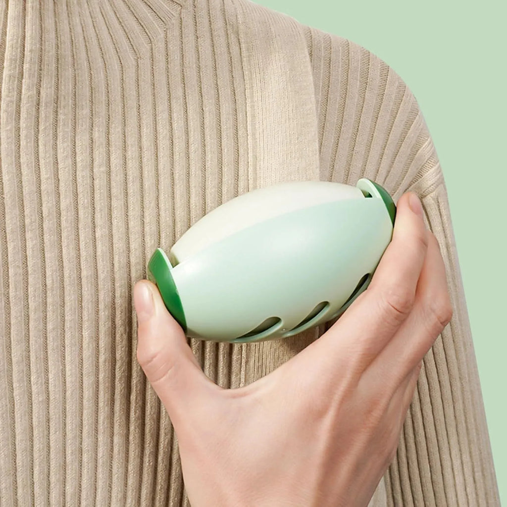 Green and white washable gel lint roller balls for pet hair removal on fabrics