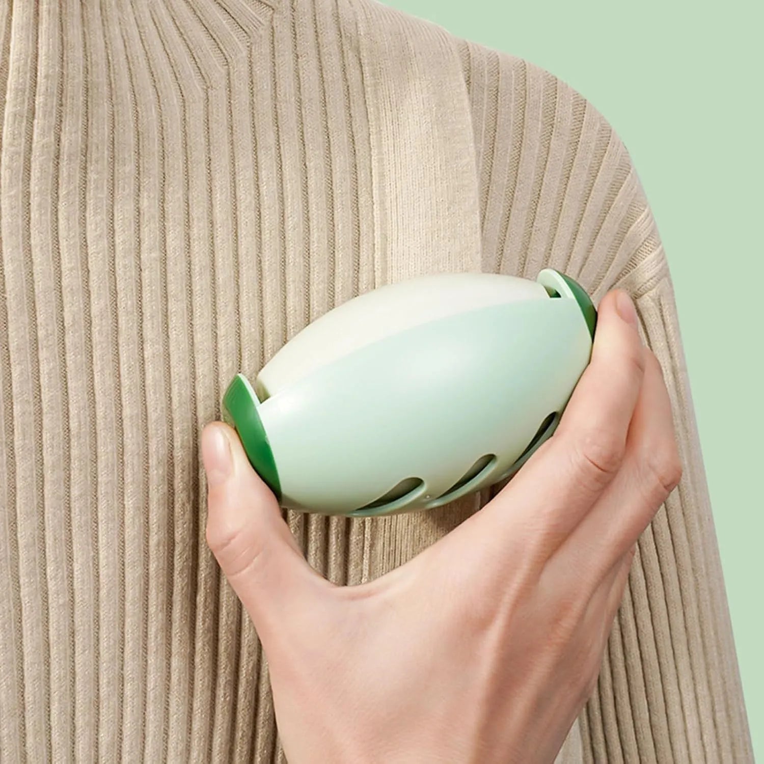 Green and white washable gel lint roller balls for pet hair removal on fabrics