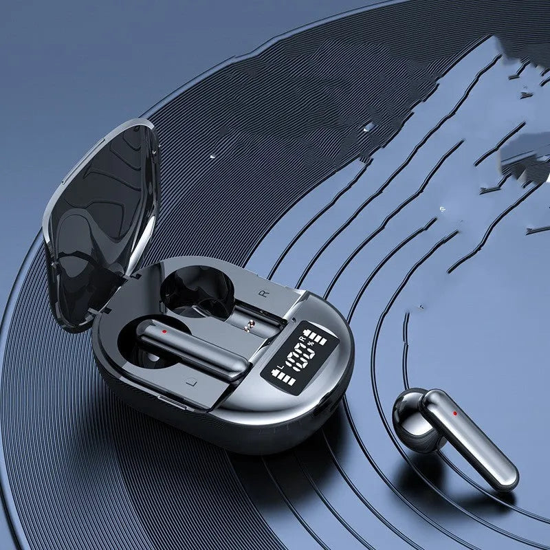 Black and white wireless in-ear Bluetooth headset with digital display next to its charging case.