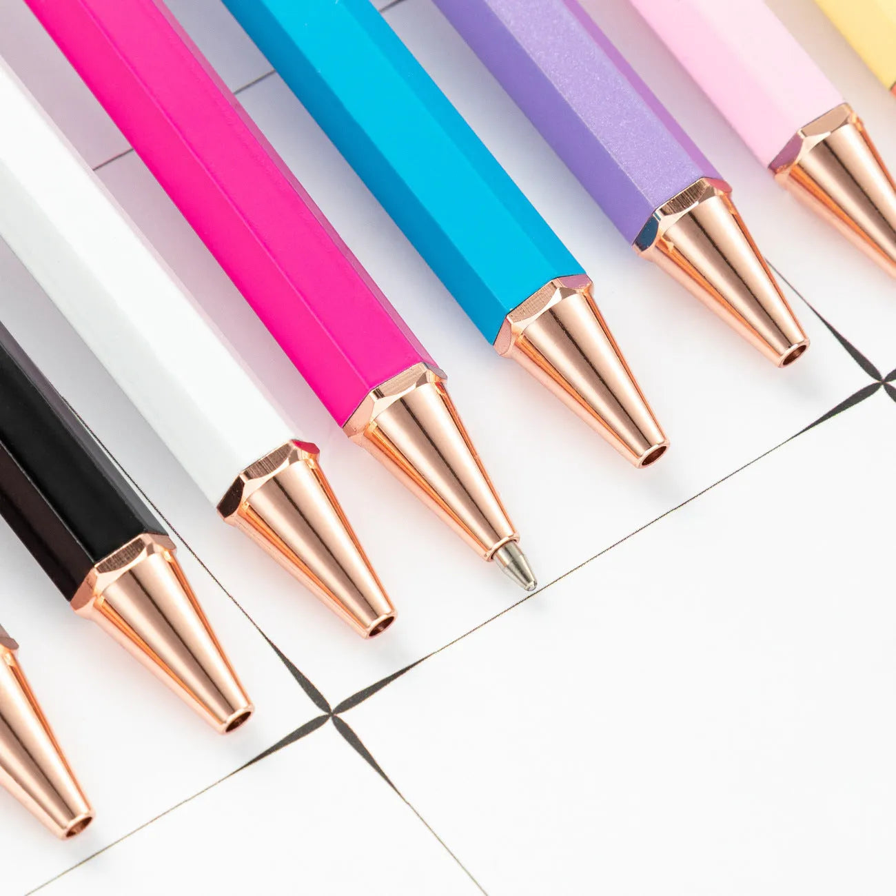 Metal ballpoint pen with six-angle rod body and bullet tip in black colour on white background