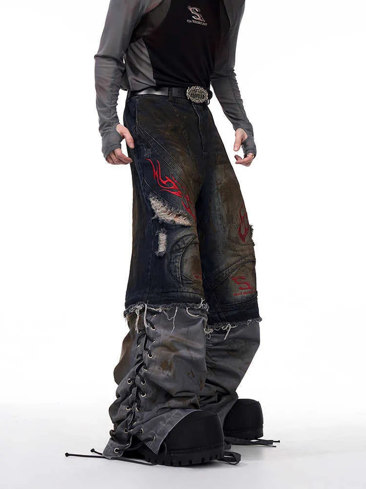 Man wearing retro-style wide leg jeans with detachable trouser legs in a picture colour denim.