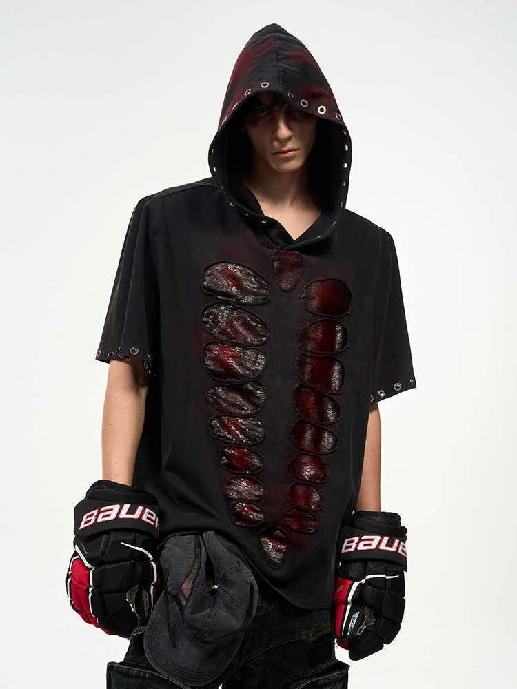 Black men's hooded short-sleeved t-shirt with sequin detailing, loose fit, shown in casual wear setting