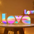LED LOVE Light with rainbow-coloured lampshade displaying LOVE word for romantic decoration