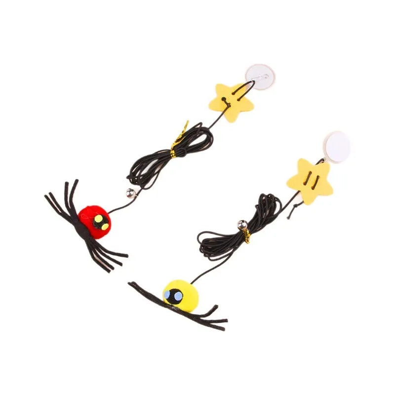 Red and yellow cat door toy with elastic rope, feather, bell, and spider dangling for interactive play.