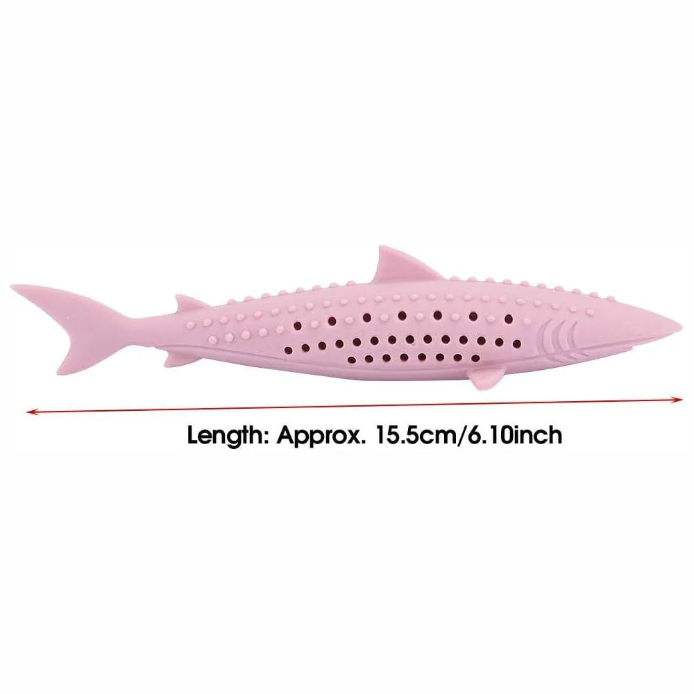 Green silicone fish-shaped cat chew toy with side holes on a white background
