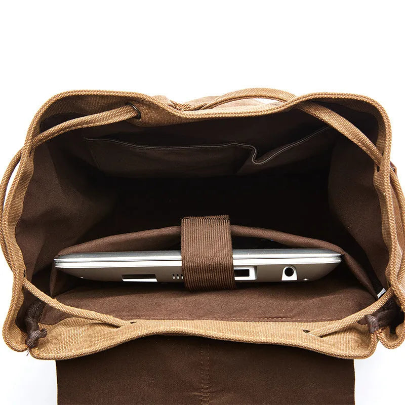 Canvas travel backpack in khaki with airpillow straps and sewing line detailing