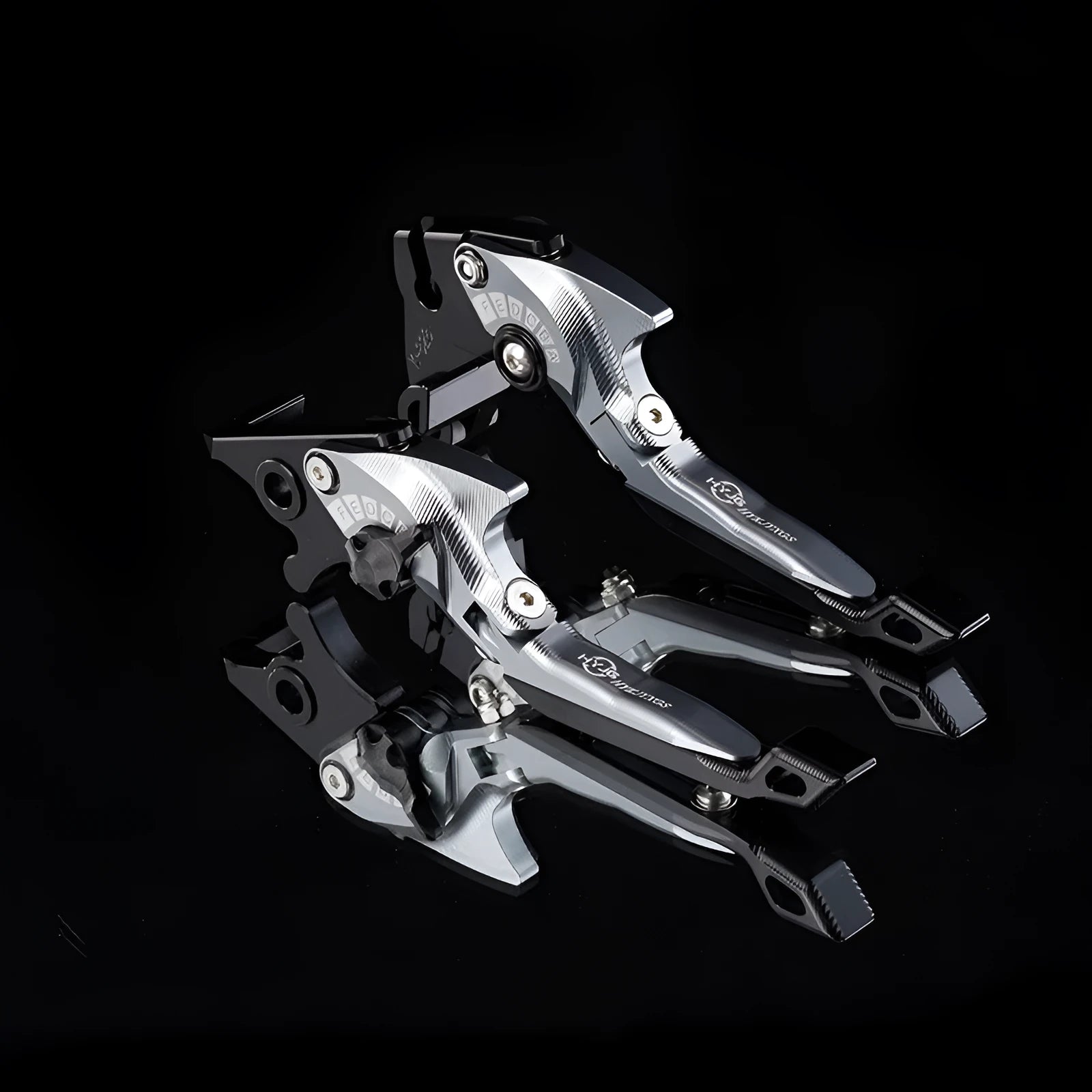 Pair of anodised metal motorcycle clutch levers with adjustable length mechanism in a selected colour.