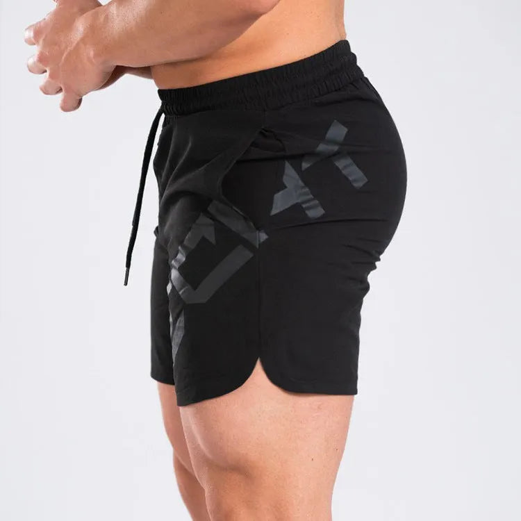 Men's knee-length quick-dry nylon sports shorts in black with elastic mid-waist