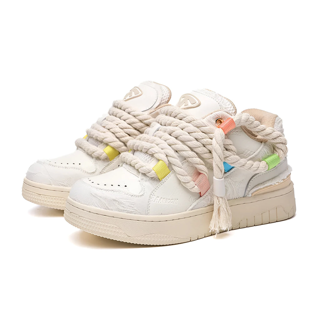 Creamy white low-top retro skate shoes with platform heel and lace-up design on a plain background.