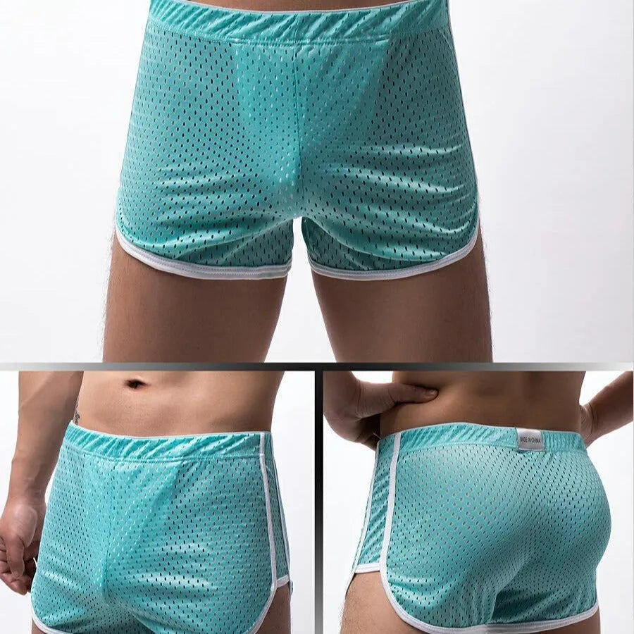 Men's cotton boxer shorts in grey, showing mid waist design and breathable nylon fabric knit.