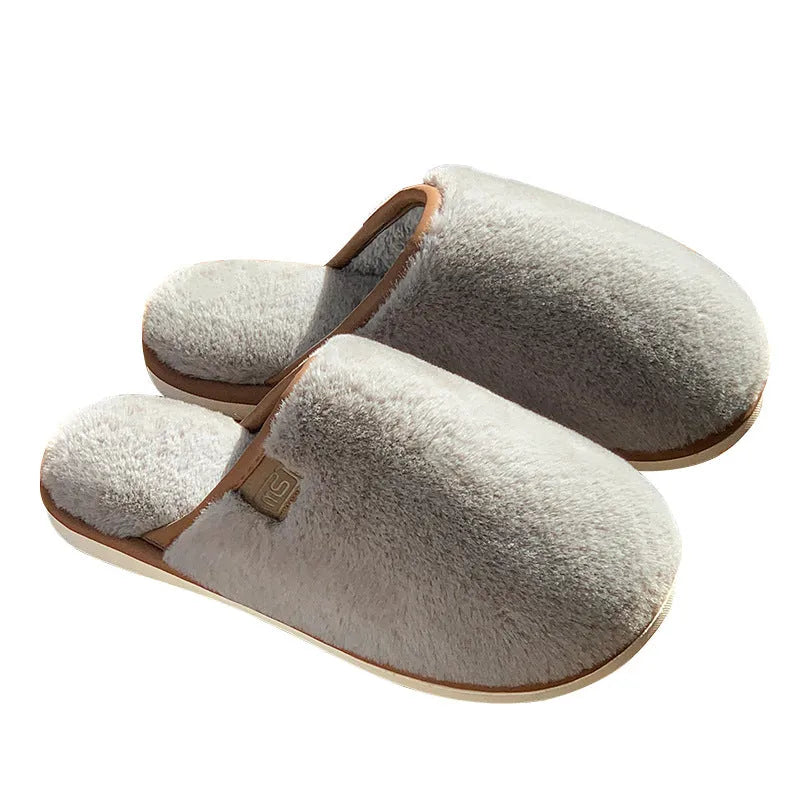 Solid colour winter plush slippers with decorative car stitching and non-slip PVC sole