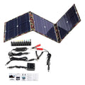 Black foldable 36W portable solar panel with car charger and USB hub accessories on a table.