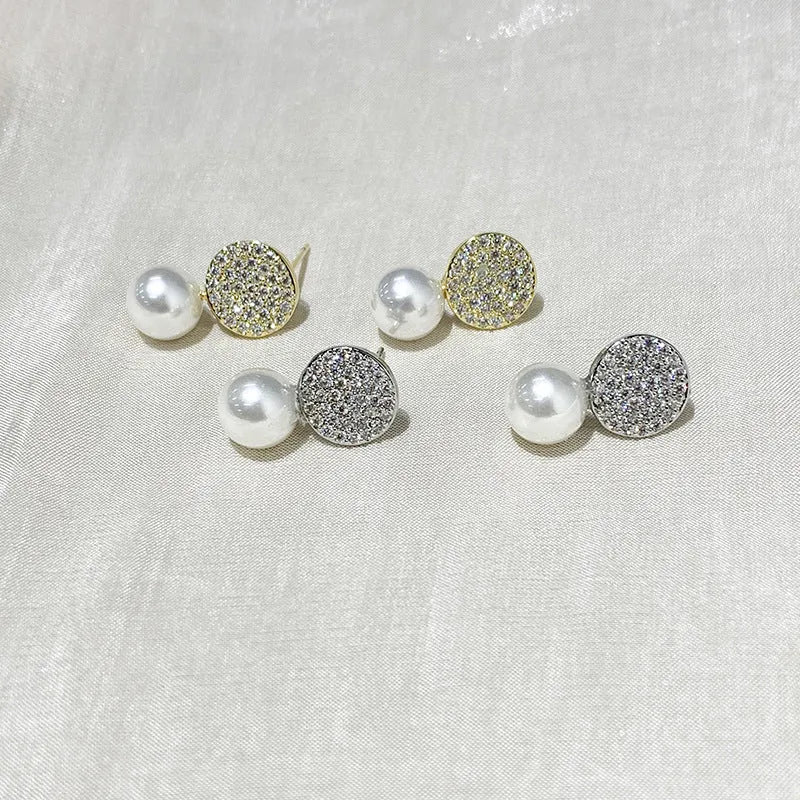 Round diamond studded pearl earrings in gold finish with secure stud fastening