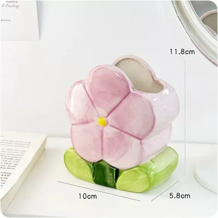 Ceramic floral pen holder storage box on desk with blue flower pattern