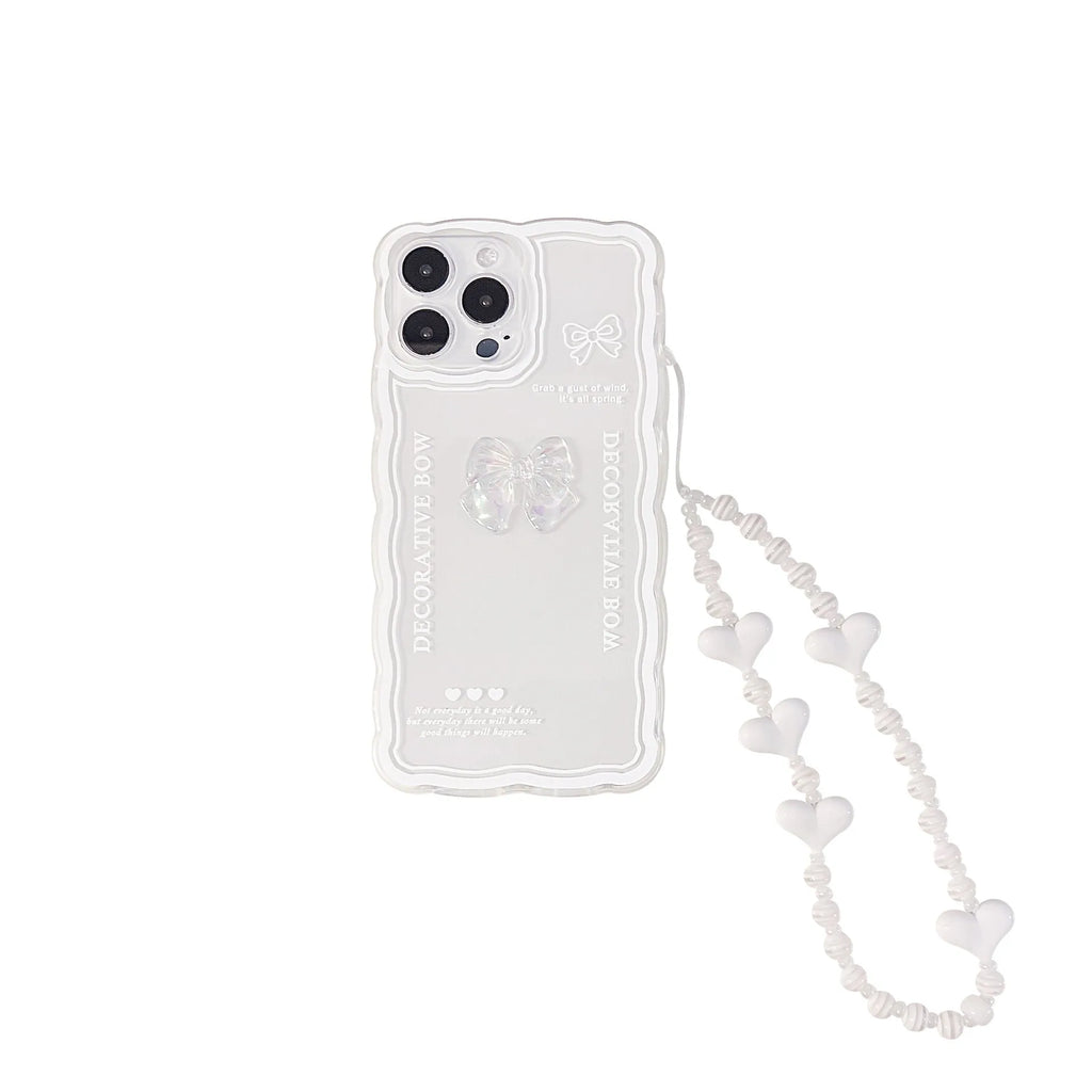 Transparent iPhone case with 3D ice-effect bow decoration on back, optional white lanyard attachment