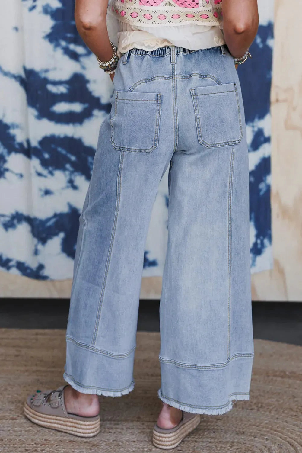 Beau Blue wide leg denim trousers with drawstring waist and raw hem detailing
