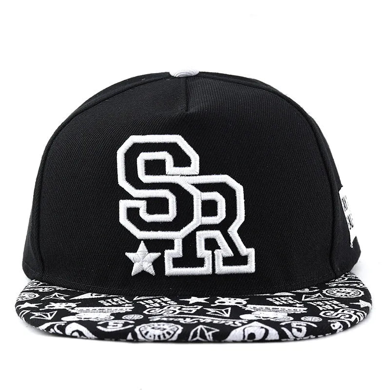 Black cotton baseball hat with white embroidered letters on the front, showing the dome crown shape.