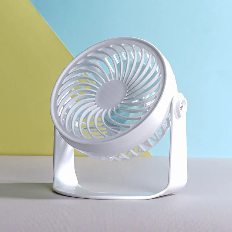 USB-powered mini clip fan with brushless motor and three blades on white desk