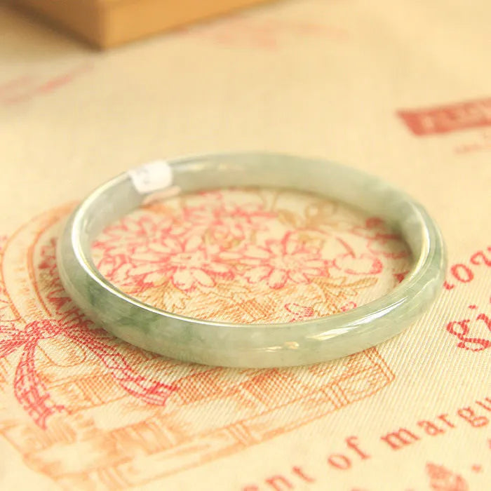 Green jade geometric bracelet with waxy finish, 10mm diameter, Chinese-style design