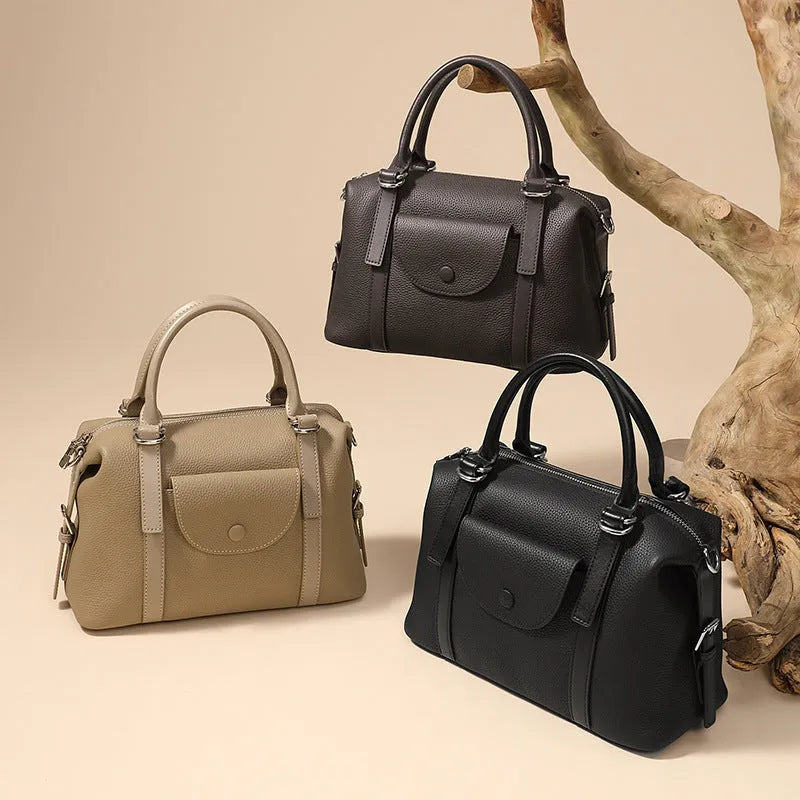 Genuine leather ladies handbag in black, brown, or elephant grey with lock detail and shoulder strap