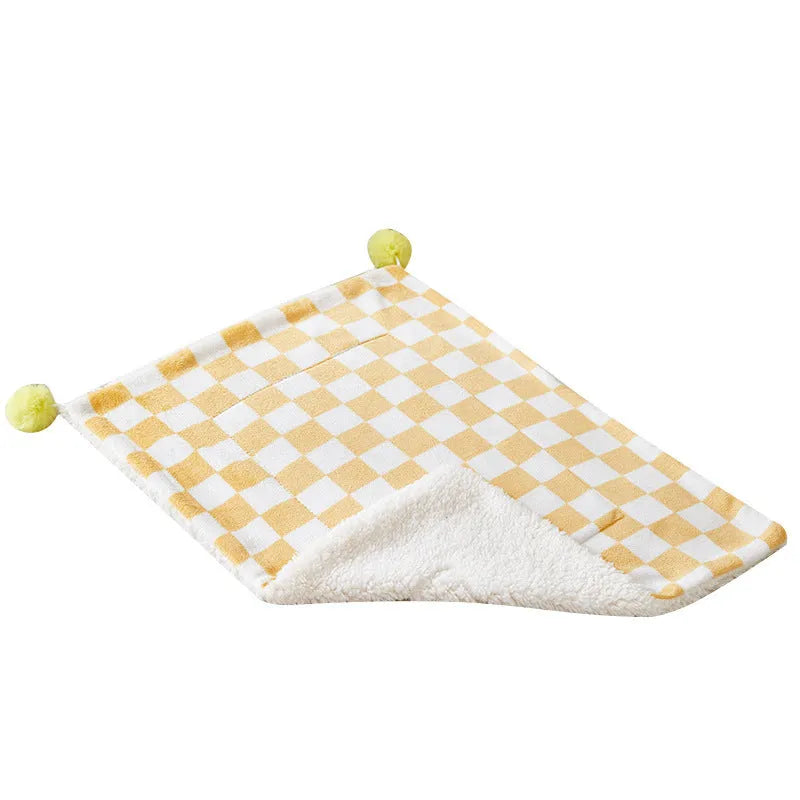 Plush fleece pet blanket with plaid pattern and fur ball decoration for cats and dogs