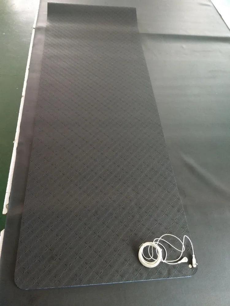Blue conductive yoga mat with plants pattern, showing grounding wire and 182x61cm dimensions