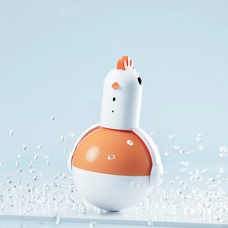 Green or orange electric cat toy chicken with laser and sound features on a flat surface.