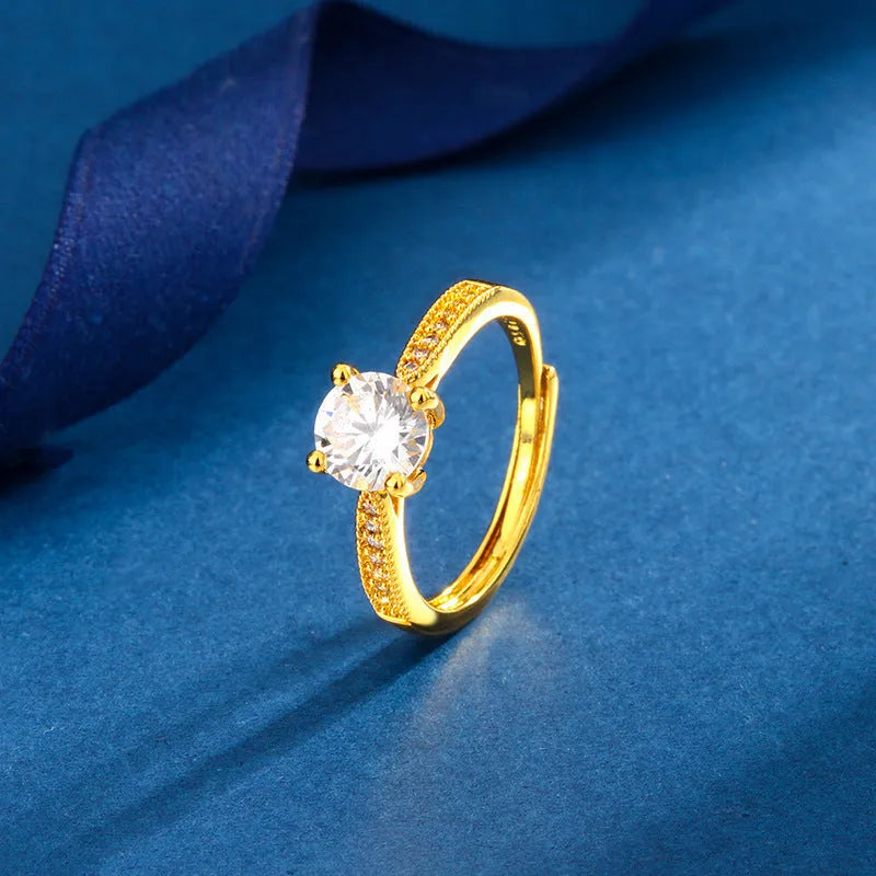 Classic four-claw ring with 1 karat eight hearts eight arrows zircon in gold colour on white background