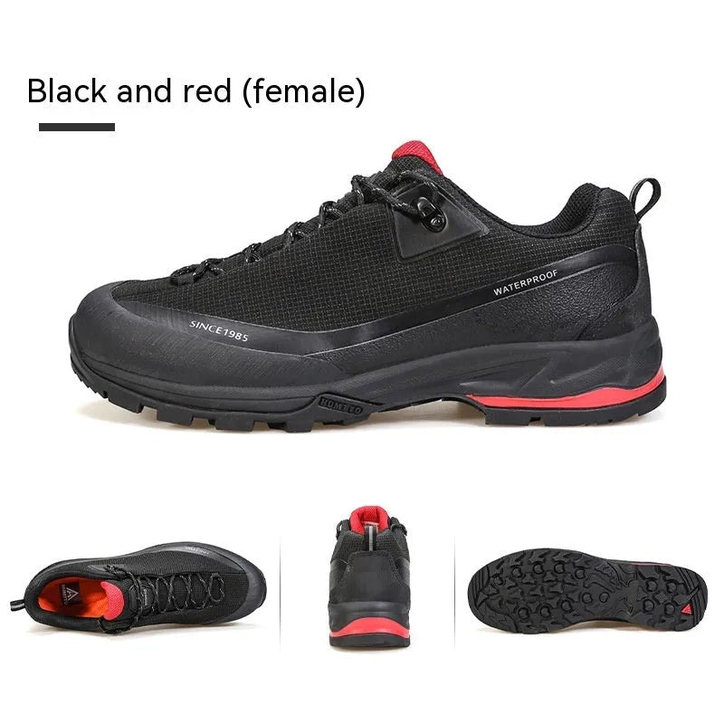 Men's low-top hiking boots in black with leather mesh upper and lace-up front.