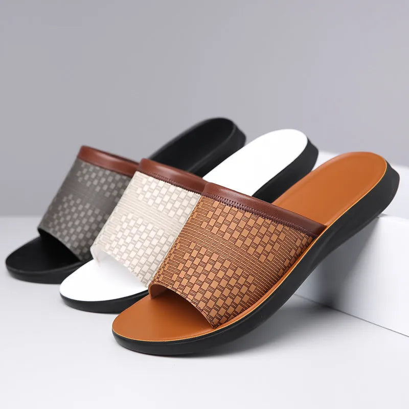 Men's breathable PU leather slippers in black with flat heel and round toe, side view