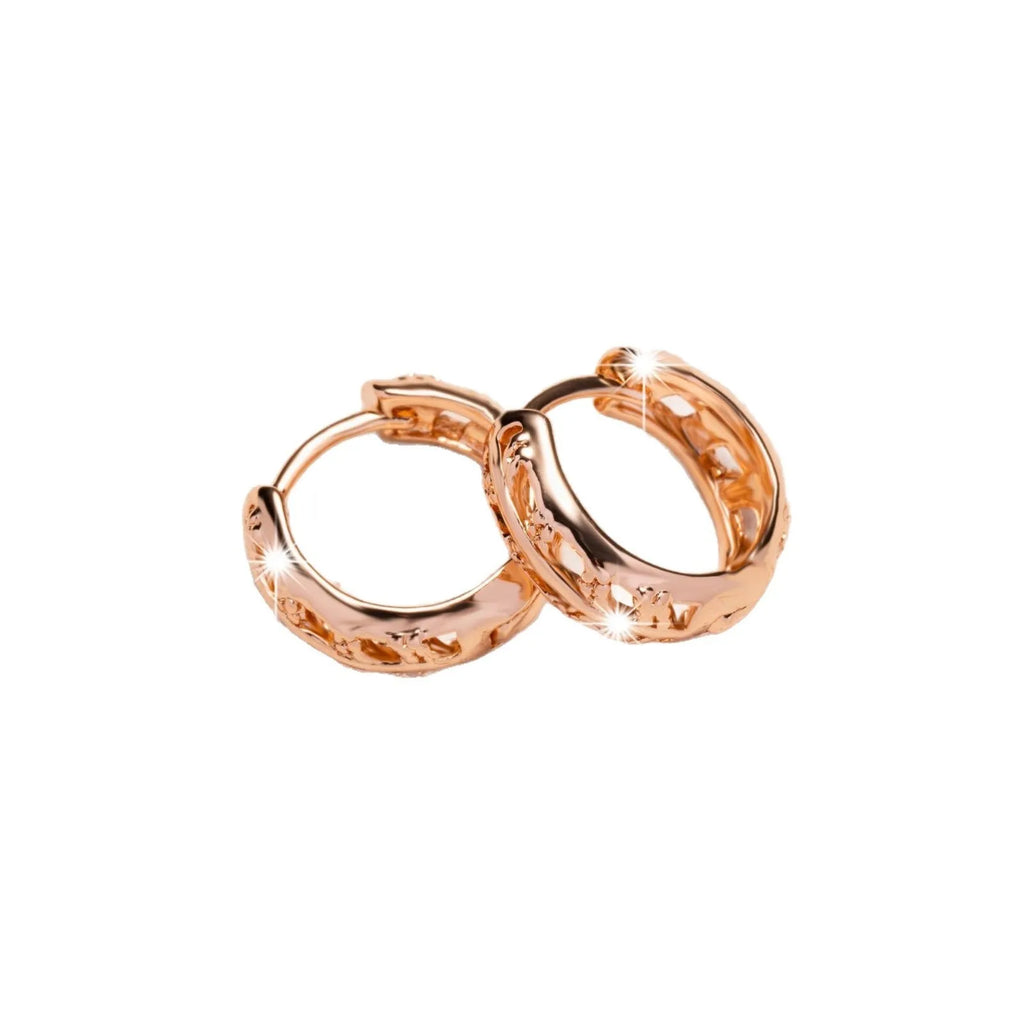 Copper earrings with rose gold finish featuring hollowed-out leaf and heart shapes