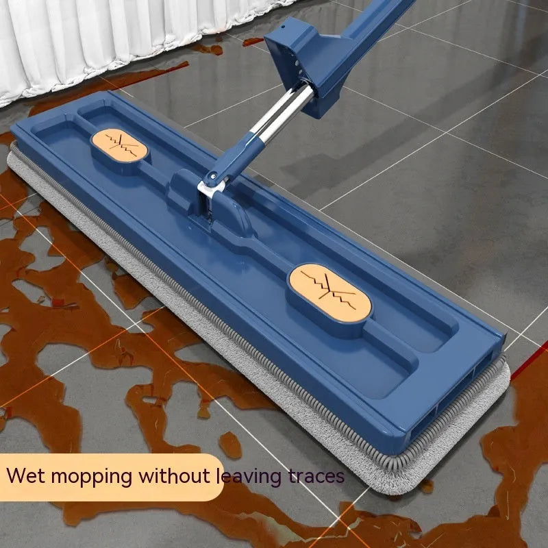Large flat mop with a long stainless steel handle and a blue microfiber cloth on a hard floor.