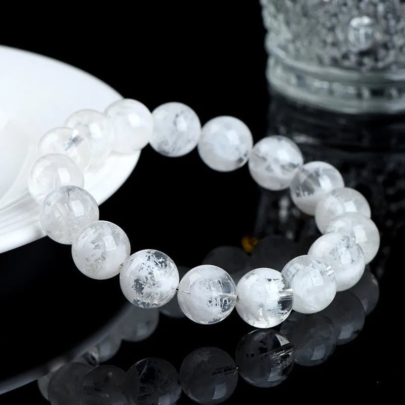 Women's bracelet with round blizzard snowflake crystal beads and traditional Ruyi Xiangyun decorative elements.