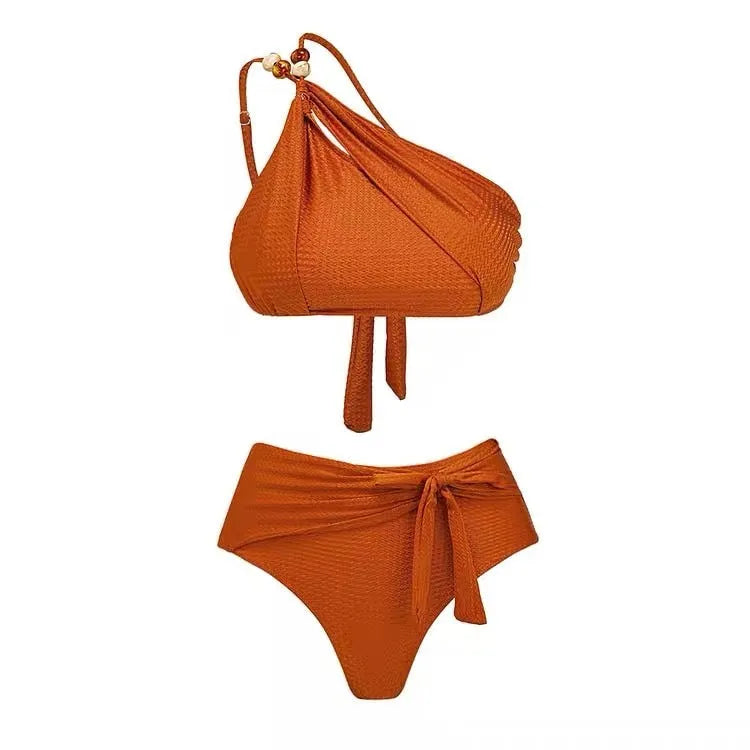 Women's brown high-waist push-up bikini with a sheer split chiffon dress overlay.