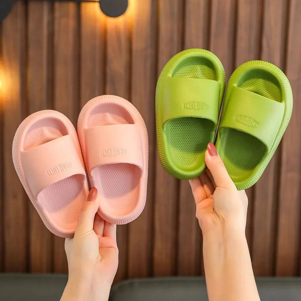 Children's EVA slippers in mixed colours with non-slip soles showing size range 24-35