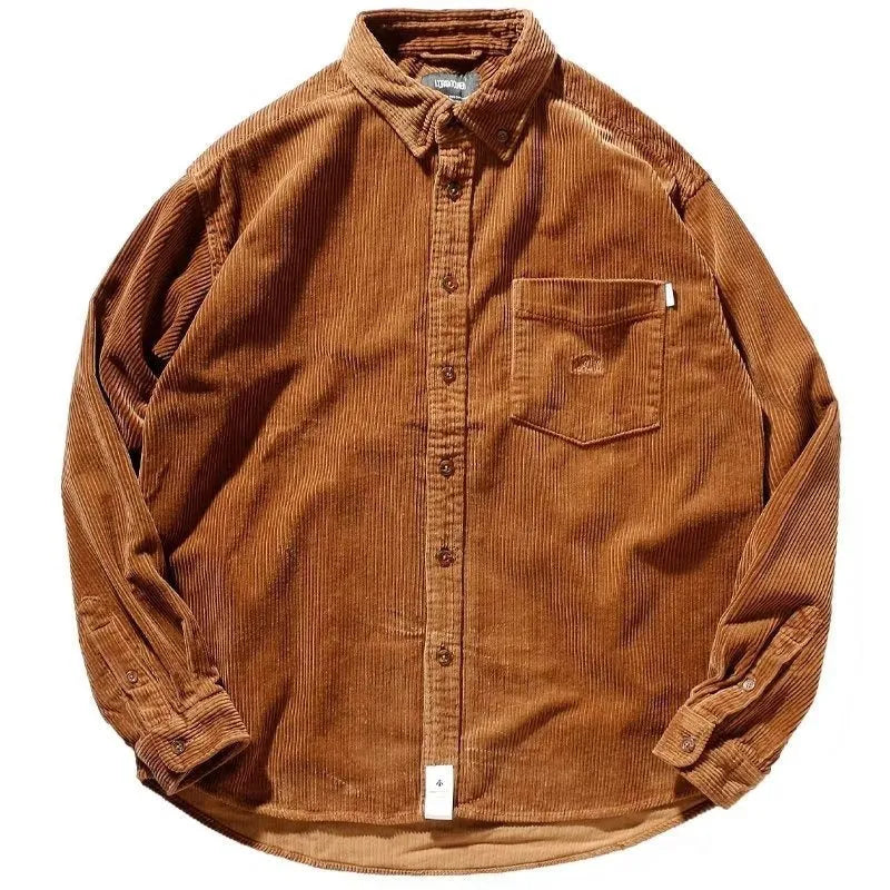 Caramel loose fit corduroy long sleeve shirt with cardigan style on a hanger.