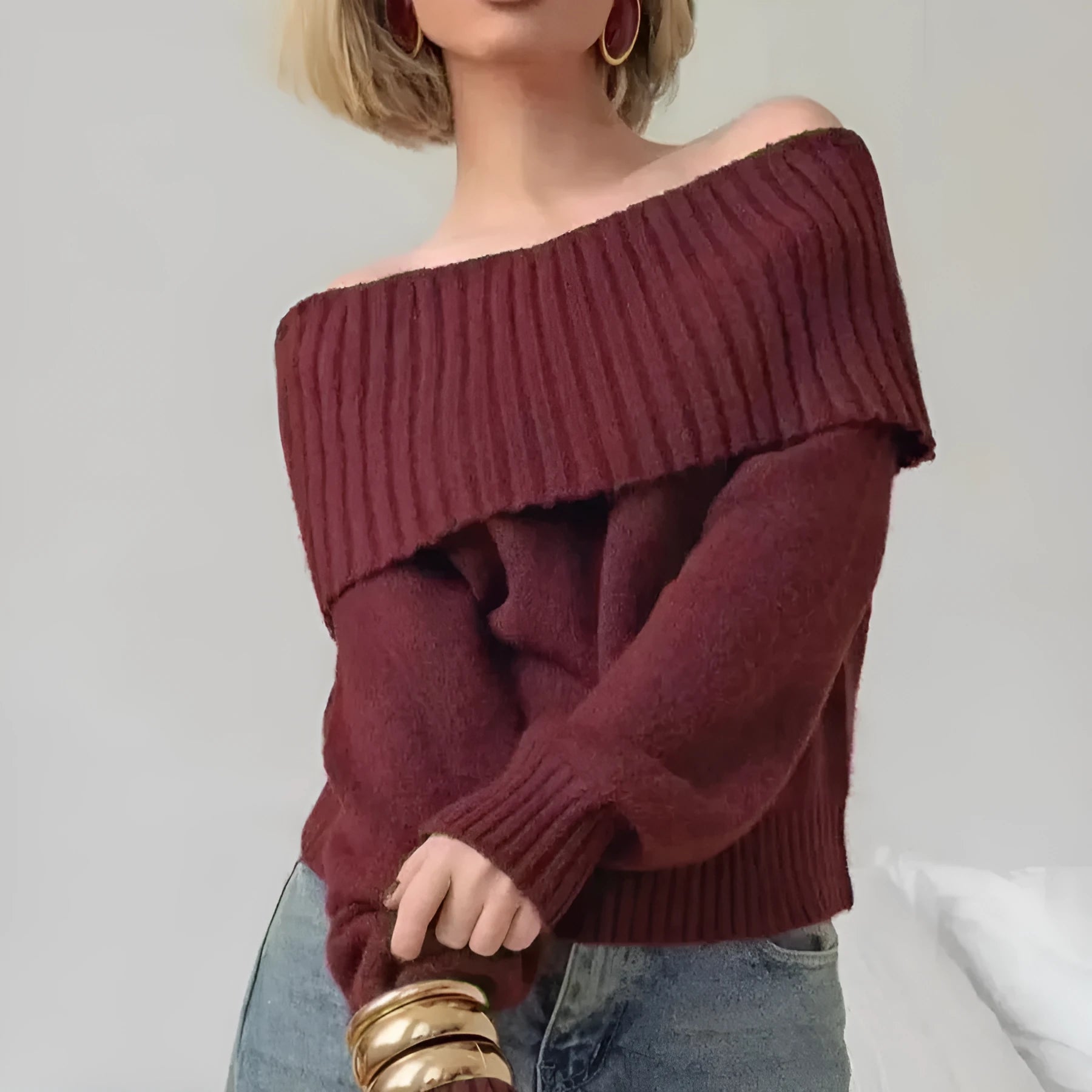 Grey off-the-shoulder strapless pullover sweater with a 3D pattern on a model.