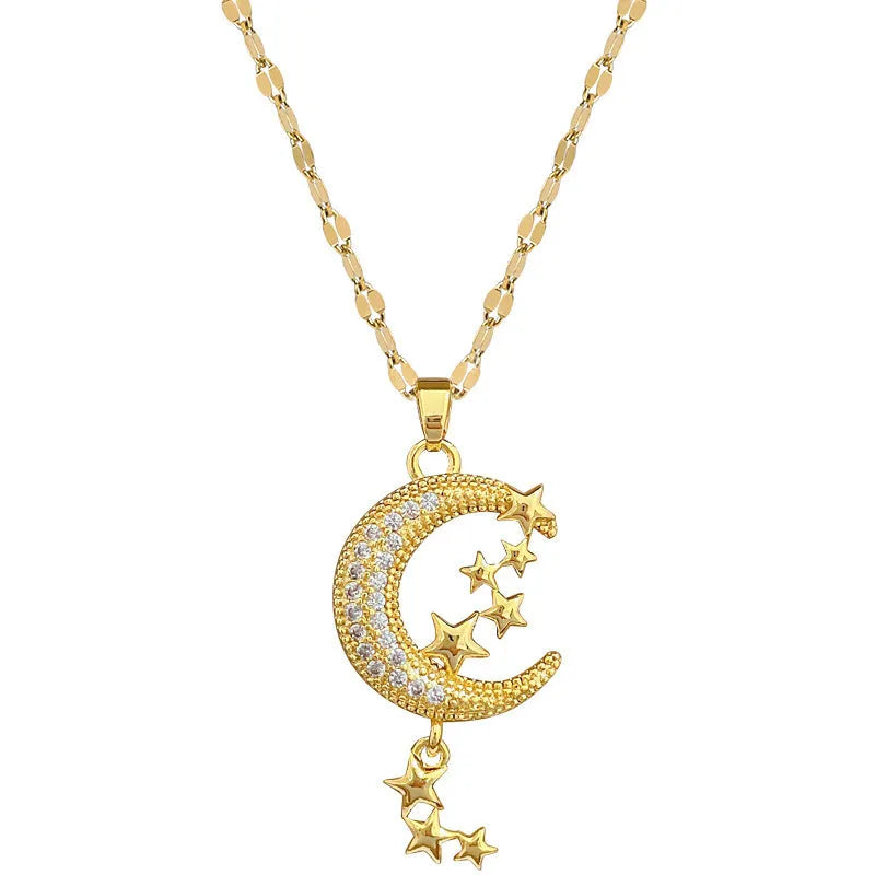 Moon pendant necklace with diamond accents and tassel on stainless steel chain