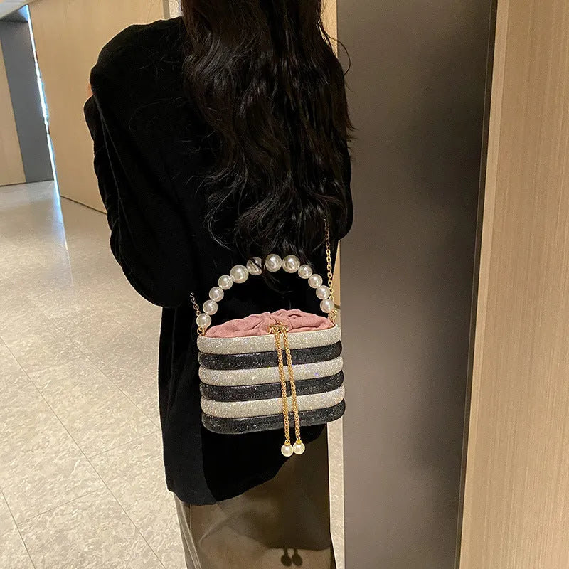 Women's retro style crossbody dinner bag with pearl detailing in soft PU leather