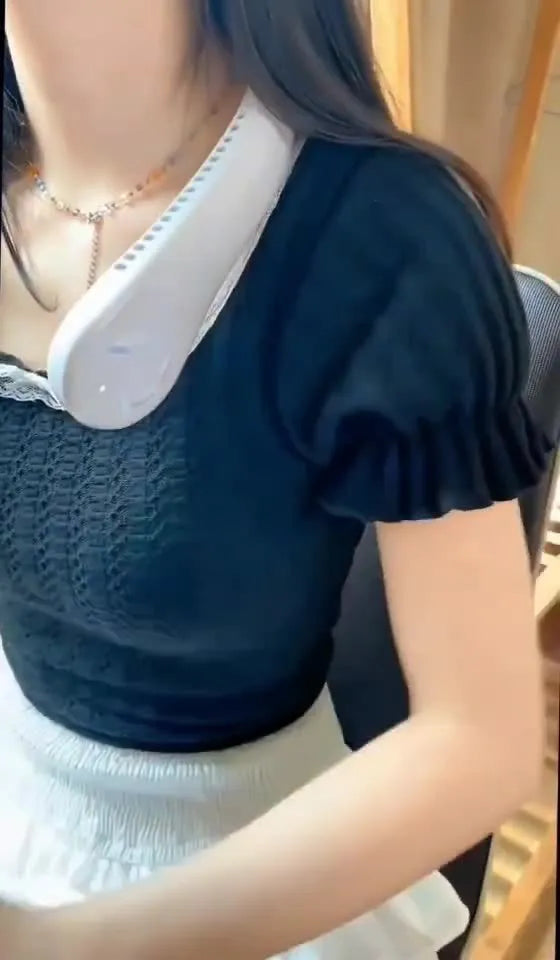 Blue USB rechargeable bladeless neck fan being worn, showing its lightweight design and adjustable controls.