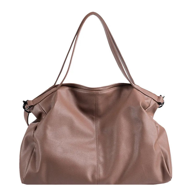 Large soft surface PU messenger tote bag in a horizontal square shape with a zip top and long shoulder strap.