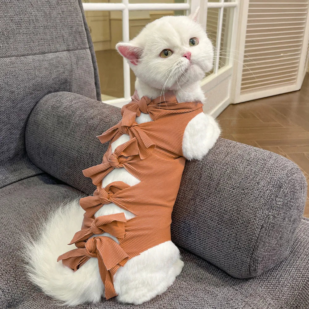 Lace-up polyester recovery clothing for cats after sterilisation, shown in multiple colours and sizes.