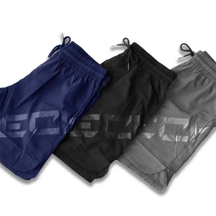 Men's knee-length quick-dry nylon sports shorts in black with elastic mid-waist