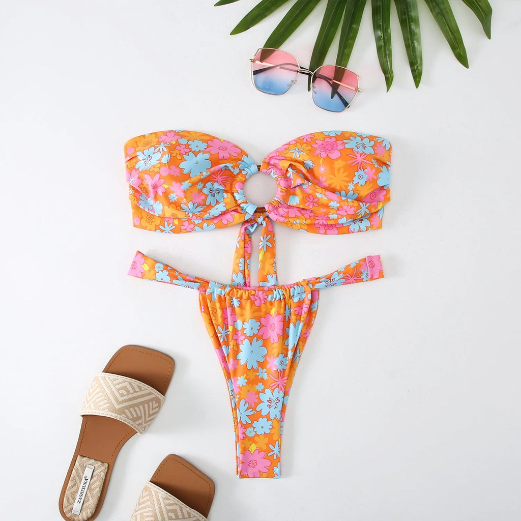 Women's floral print tube top bikini swimsuit with backless design on a mannequin